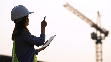 Female civil Engineering working with tablet on construction site