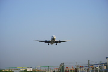 Airplane landing on runway at the airport - 着陸する飛行機 後ろ姿 飛行場	