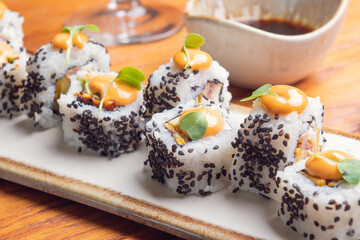 Sushi and soy roll on wooden table. Sushi menu. Japanese food
