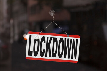 Lockdown sign on the window of a shop