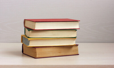 stack of color-covered books on the table.