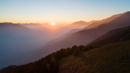Valtellina, Italy, autumn sunset aerial view