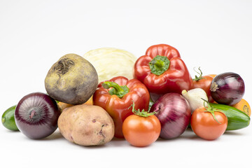 An assortment of vegetables is isolated on a white background.