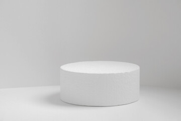 White round 3d podium for presentation of products, cosmetics on white isolated background. Abstract minimalistic concept of beauty industry. Close-up, copy space