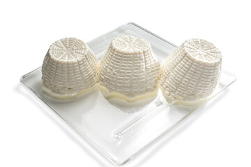 Italian Ricotta cheese, three forms of Cottage cheese on a square glass plate, isolated on white