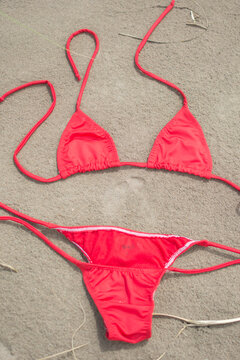 red bikini on sand