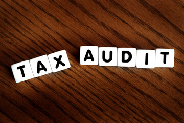 Tax Audit Spelled Out in Block Words Representing IRS Audit Stressful Taxes
