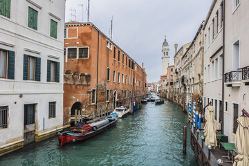 View of Rio dei Greci (Greeks' Canal) with the leaning bell tower of the orthodox church of San Giorgio dei Greci (1592) in the background. Venice, Veneto, Italy.