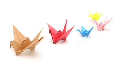 Origami paper birds teamwork on white