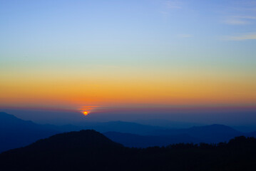 Fototapeta premium sunset over the mountains with dramatic sky