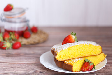 Slice of Shaker Lemon Pie onwhite plate with strawberries. Lemon tart.
