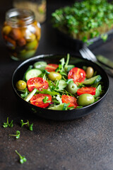 fresh salad vegetables olives tomato, cucumber, lettuce mix leaves snack trend meal copy space food background rustic. top view keto or paleo diet vegan or vegetarian food