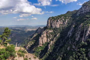 Fototapeta na wymiar View of mountains and plains surrounding Abbey of Montserrat (Santa Maria de Montserrat) in Catalonia, Spain