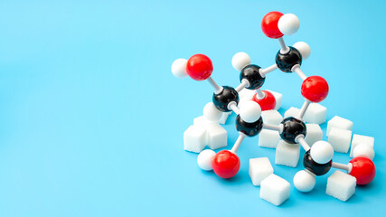 Simple sugars, diabetes awareness and chemical structure of carbohydrates concept with plastic...