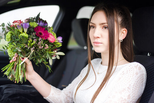 young girl bride in car