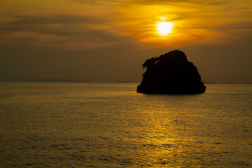 Fototapeta na wymiar A silhouette small remote island in the middle ocean