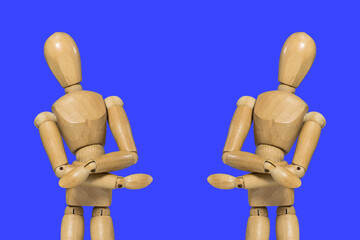 Two Wooden figure doll pose in cross arms gesture on colorful background. creative leaders