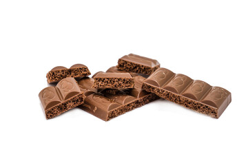 Aerated milk chocolate isolated on white background.Photo with shallow depth of field.