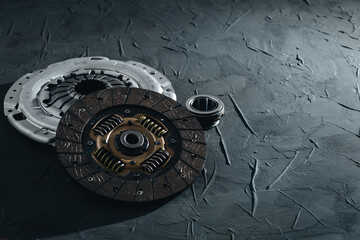 Automotive clutch mechanism, disc, basket and bearing for auto on a black background.