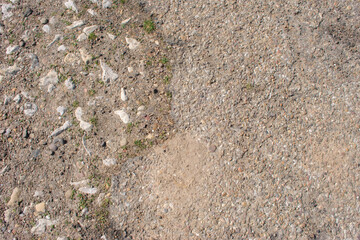 background texture earth and stones on a path in the bush