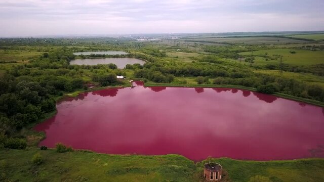 aerial shot on unusual pink lake in industrial zon