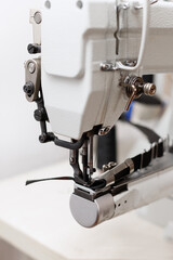 sewing machine with black ribbon in the factory