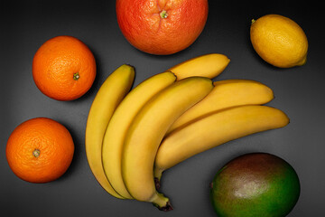 Tropical fruits on black background