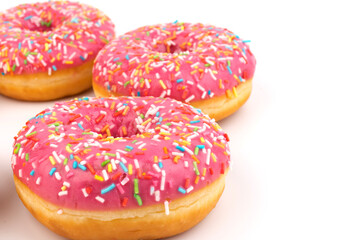 Fresh made Donuts isolated on white background. Doughnuts are traditional sweet pastries. Copy space for text.