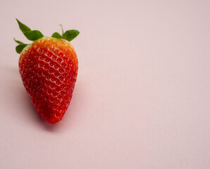 juicy strawberries on a pink background