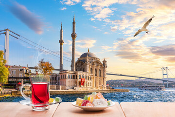 Fototapeta premium The Bosphorus bridge, Ortakoy Mosque and turkish tea, Istanbul