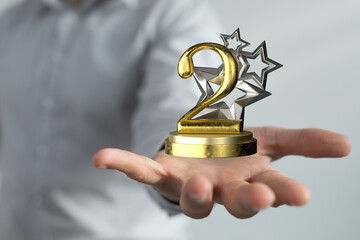 success 2nd place in hand