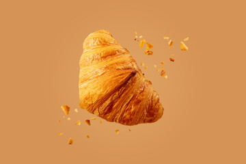 Freshly baked croissant flying in air.