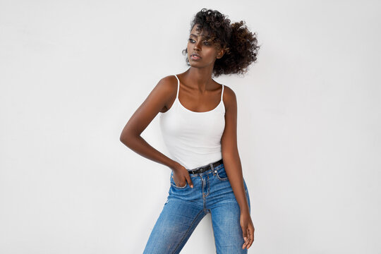 Fashion photo of beautiful black female model isolated on white background