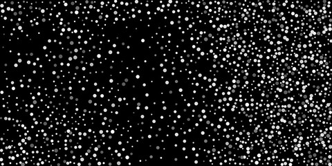 Silver shine of confetti on a black background. Luxury background.