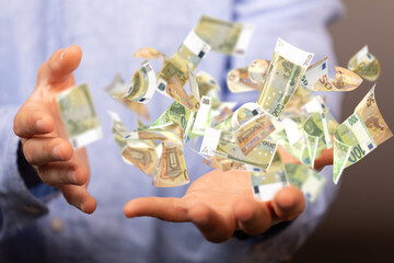 money euro banknote in hand rain