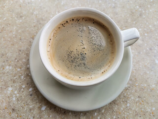 Cup with coffee on a table in a cafe