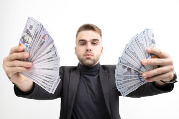 Close- up of a guy holding dollar bills in two hands