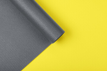 Two yoga mats in fashionable colors illuminating yellow and gray shot from above close up © Александр Маликов