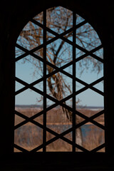 window with a lattice overlooking nature