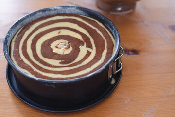 Marble sponge cake elaboration process. Copy space. Pastry.