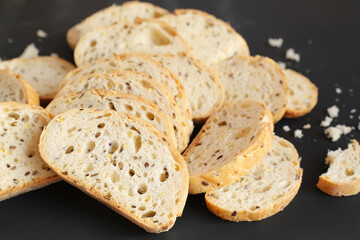 White sliced bread close-up on the background. Baked goods and flour products. Homebaked bread. Sandwiches and recipes. Healthy food and non-GMO foods.
