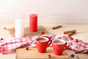 Two red cups. Cocoa, coffee, chocolate, romantic evening. The concept of building personal relationships. Date of lovers. Romance in a relationship. Delicious dinner.