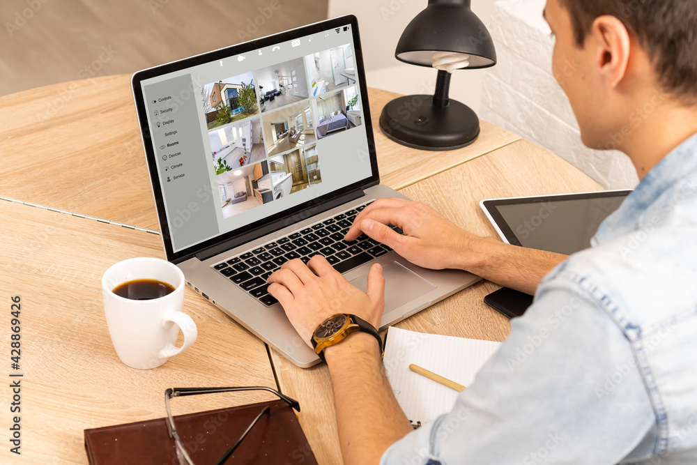 Aufkleber man having home automation control station in a modern home 3d render