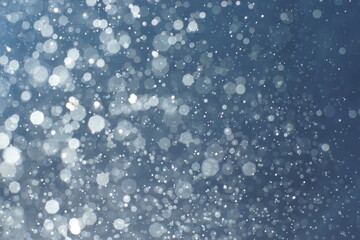 Blacks and drops on a blue-to-blue gradient background