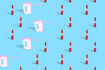 . Creative idea. Lipstick and kitchen mixer on a blue uniform background. Pattern. Fashion or homework.