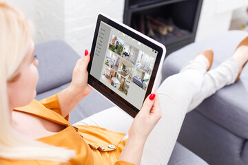 Woman having a Home automation control station in a modern home 3D render