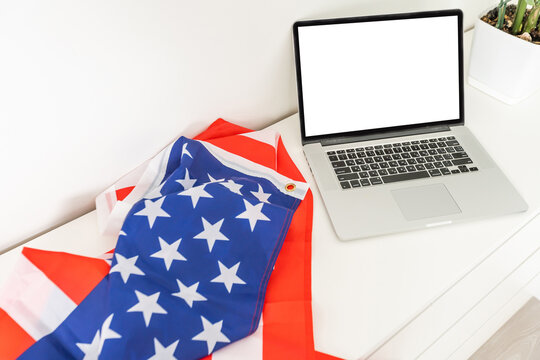 flag of usa on independence day on 4th of july , isolated on white background, behind a blank empty computer pc screen display