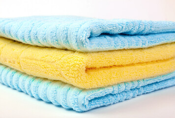 Side view of a stack of fluffy terry towels