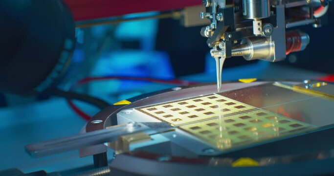 Modern high-tech industrial equipment.An industrial cnc robot works with a computer board microchip.Close-up.