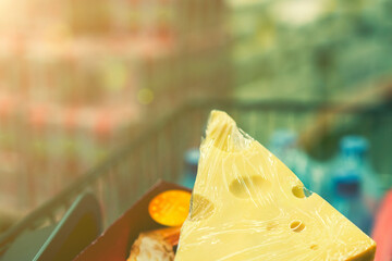 Cheese in a shopping cart. toned